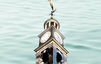 This beautifully restored Nelson’s Clock is hauled onto a barge in Deptford and sailed down the Thames