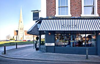 Outside Cote Brasserie Blackheath, an elegant building onlooking Blackheath common.