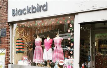 Outside Blackbird Boutique in Greenwich, showing a stylish store with plenty to shop for.