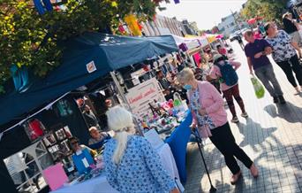 A look into Eltham's producer market, showing a range of stalls each with their own unique items and foods.