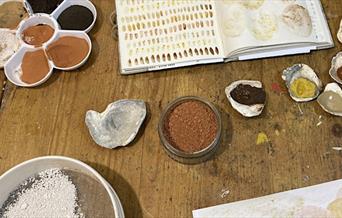 Transform ordinary earth into luxurious watercolour paints, creating your own colour palette to take home with you!