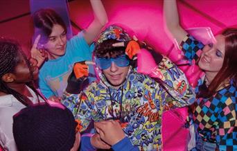 A group of “neeks” gather to hold a midnight rave