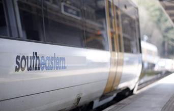 A Southeastern Railway train at a station platform.