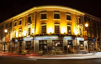 Night view of the historic 19th century building well lit up at one corner of the Greenwich Market.