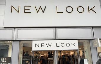 Outside New Look in Charlton, showing a large white building with a huge selection of fashionable items.