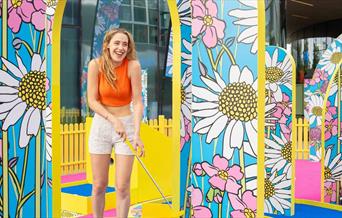 Swing into a summer of play with this family-friendly, fun-filled mini golf course designed by artist Yinka Ilori