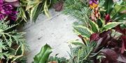 Celebrate creativity and craftsmanship as you learn to design your own natural wreath using a blend of fresh and preserved foliage, pinecones, dried f