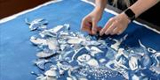 Learn how to create beautiful blue and white cyanotypes from natural resources and digital negatives, including one created from a selection of plants