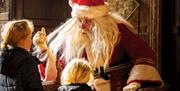 Join Father Christmas at Eltham Palace and Gardens this December for a magical way to start the festive season.