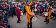 The day’s festivities culminate with a lantern parade through the Museum grounds, accompanied by the exhilarating beats of Eternal Taal’s Dhol drummer
