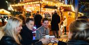 Step into the Winter Carousel and Market Quarter, where classic fairground charm meets the flavours of the festive season