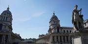 The twin dome's of Christopher Wren's riverside masterpiece, the Old Royal Naval College, in Greenwich, London.