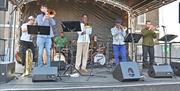 An annual day-long street brass festival and carnival of horns