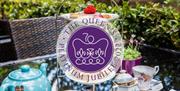 Celebrate the Queen's Platinum Jubilee with your loved ones within the stunning Tudor Gallery