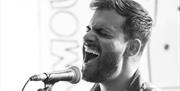 Prepare to be serenaded by the mesmerizing melodies of the incredibly talented Sam Winston