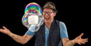 Explore the breath-taking dynamics of bubbles, combining comedy and artistry with audience participation and enough spellbinding bubble trick