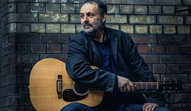 London based Americana singer-songwriter Dave Sutherland, grew up in Greenwich, with one of his very first gigs