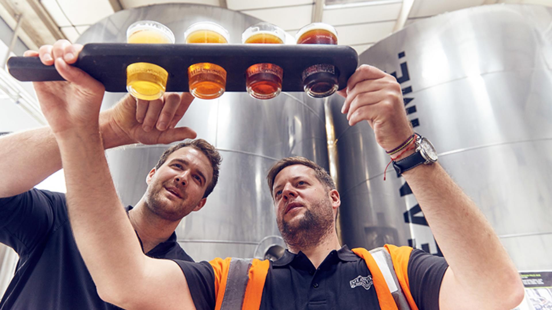 Brewers check the latest batch of brews at Meantime Brewery on Greenwich Peninsula.