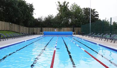 An outdoor swimming pool at David Lloyd Kidbrooke.