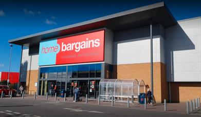 Home Bargains in Charlton. A large modern building with a blue and red banner.