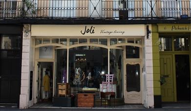 Outside Joli Vintage Living, showing a pleasant looking building filled with vintage items.