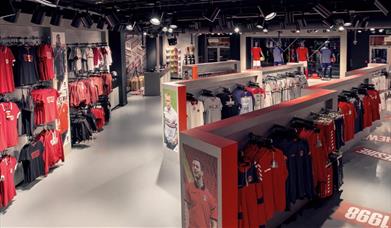 Inside the Charlton FC club shop, showing a big lit up room filled with CAFC Merchandise.