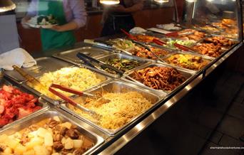 Inside China City Woolwich showing a buffet table filled with food.