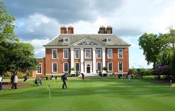 The putting green of Royal Blackheath Golf Club outside the stunning Eltham Lodge.