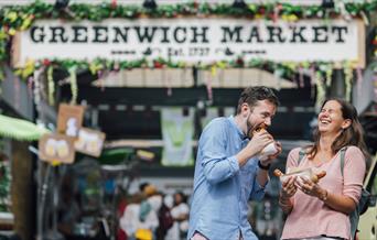 A couple enjoying their food at Greenwich Market Food Court