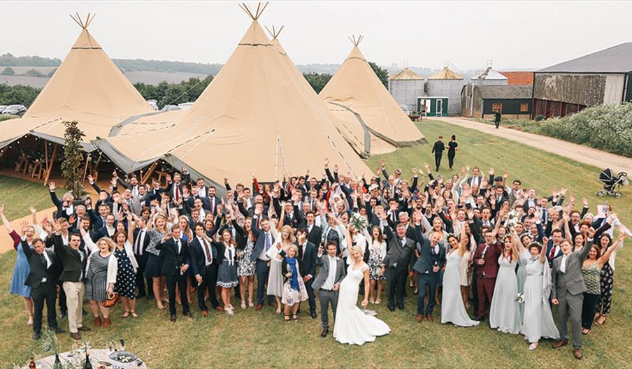 The Barns at Lodge Farm - wedding guests in The Field