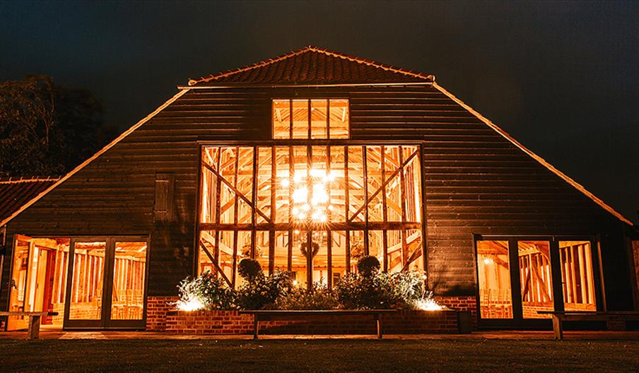 Night view of the Essex Barn wedding venue at Blake Hall Ongar