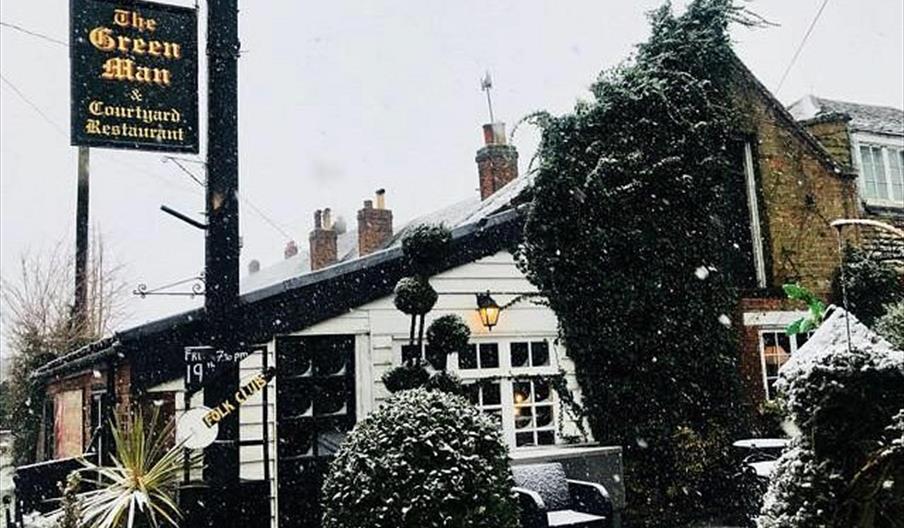 The Green Man & Courtyard on a snowy day