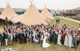 The Barns at Lodge Farm - wedding guests in The Field