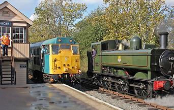 Steam and Diesel stop alongside Ongar Station signal box.