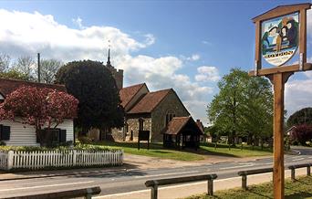 Roydon village sign and church.
