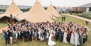 The Barns at Lodge Farm - wedding guests in The Field