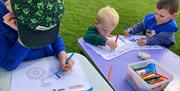 Kids having school holiday fun at Play in the Park provided free at locations across the district by Epping Forest District Council