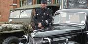 Wartime vehicles outside North Weald Station re-enacting wartime Britain on Epping Ongar Railway