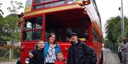 Epping Ongar Railway family enjoying a vintage bus from North Weald Station