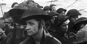 Film still from the D-Day landings showing commandos aboard a landing craft on their approach to Sword Beach, 6 June 1944.