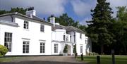 The White House Gilwell Park, a Grade II listed building set within 108 acres of mature parkland.
