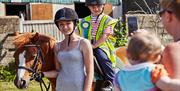 Pony riding at High Beech Riding School, Epping Forest.