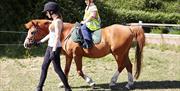 Pony riding at High Beech Riding School, Epping Forest.