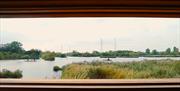 View from the Lee Valley Wildlife Discover Centre looking across Seventy Acres Lake at Waltham Abbey