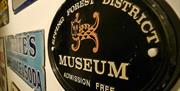 The old museum sign amongst other old signs at the Epping Forest District Museum