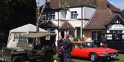 Previous North Weald Airfield Museum vehicles on display outside.