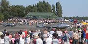 Vampires from the Norwegian Air force heritage flight taxi to the runway at a North Weald air show