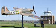 Hurricane 'gate guardian' and control tower at North Weald Airfield.