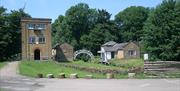 Wildlife Tower, footbridge and canal-side building at the Royal Gunpowder Mills Waltham Abbey.