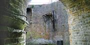 A curved tunnel entering into the Grand Nitrator at the Royal Gunpowder Mills